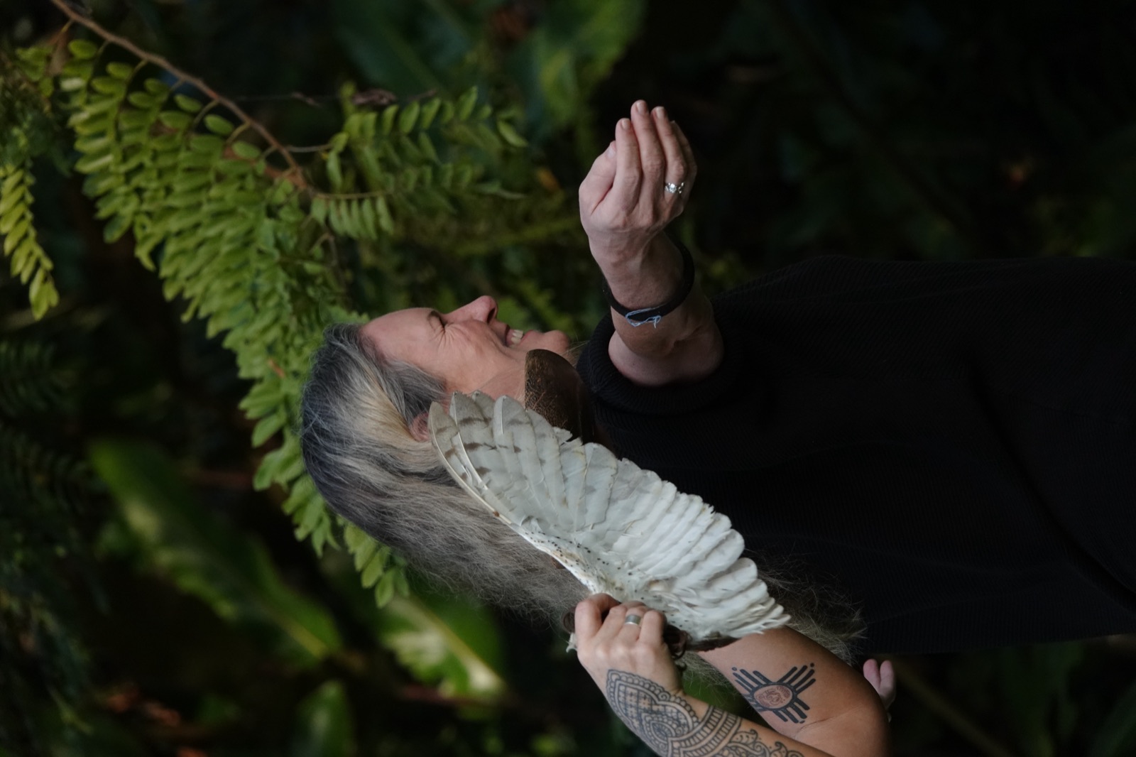 A smiling welcome with the feather fan