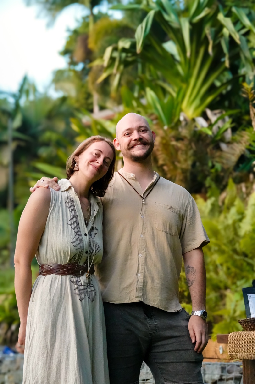 Two guests smiling in the gardens