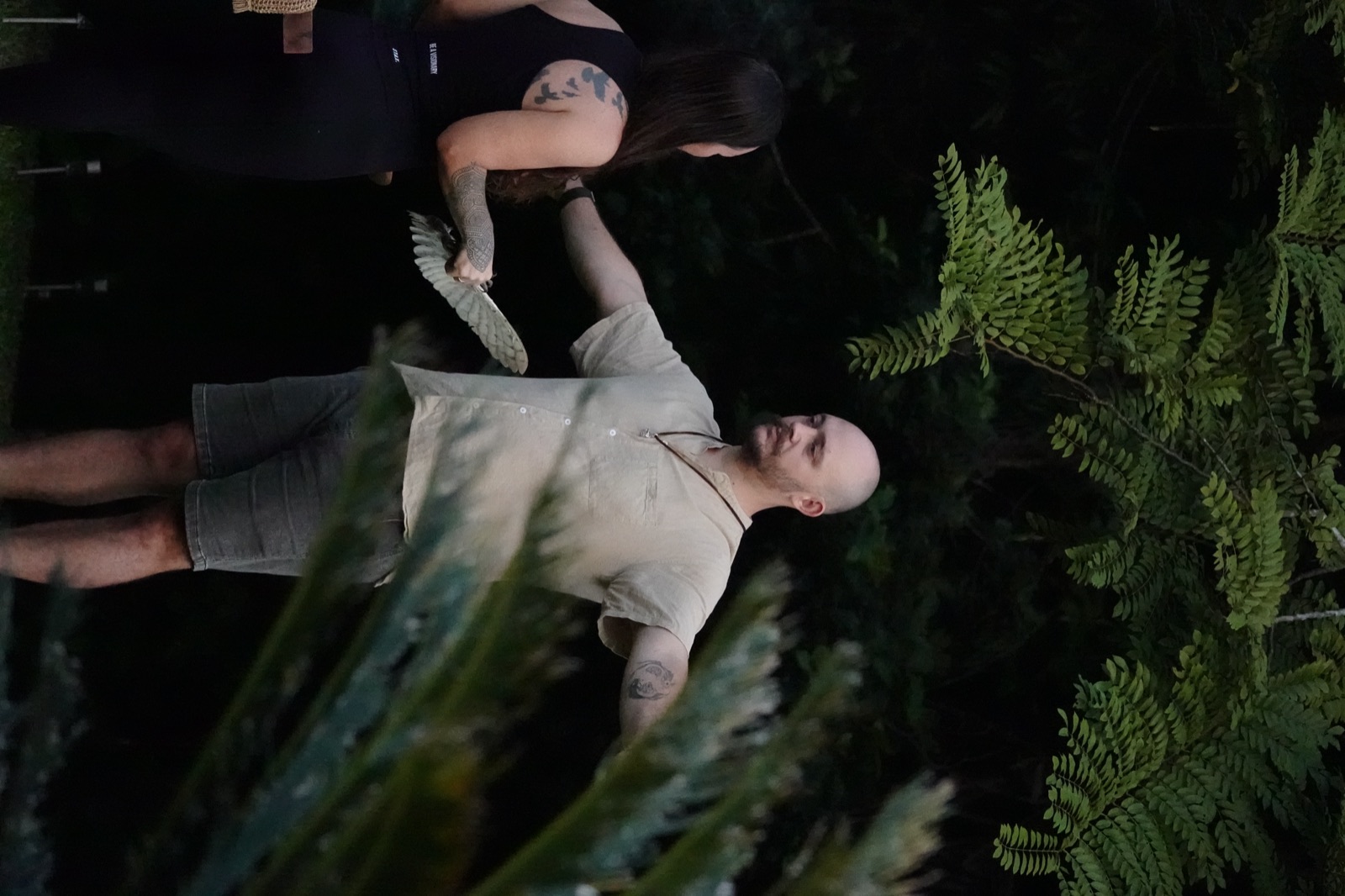 A feather blessing, arms open wide