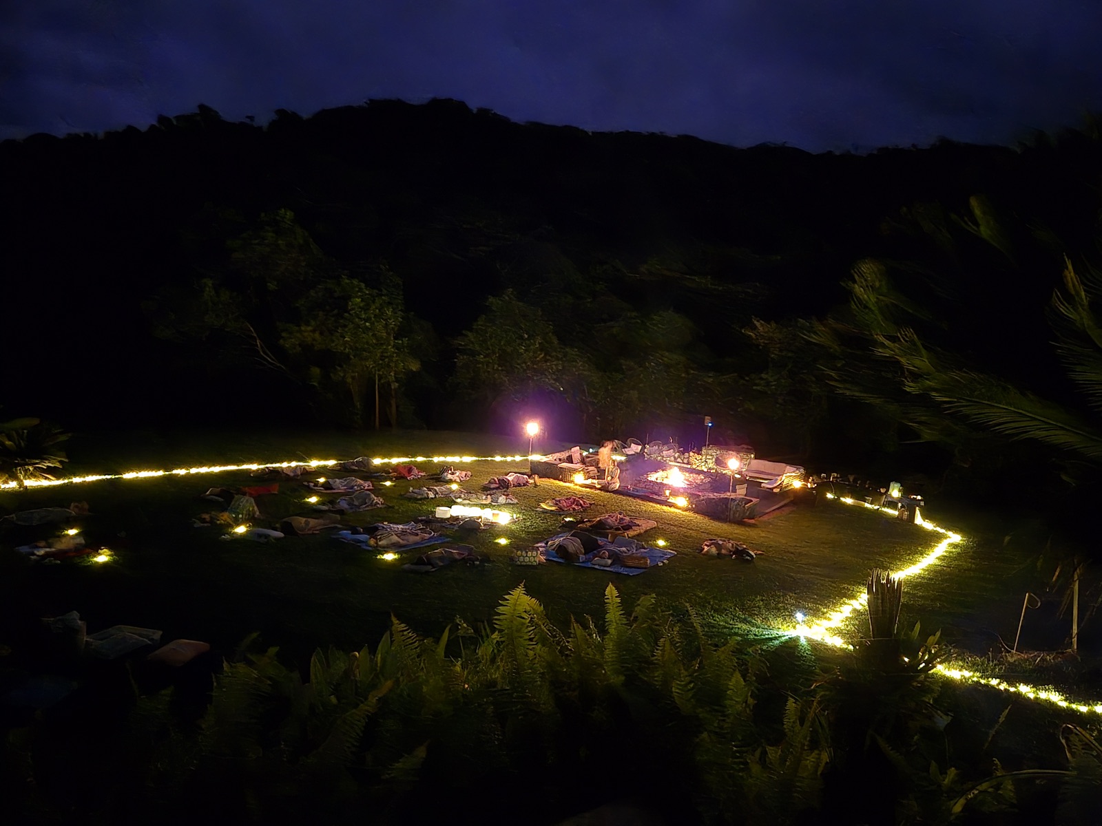 The fairy-light ring glowing around the circle at night